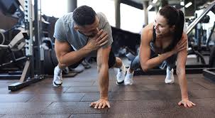 Toning Bingo Wings: Your Ultimate Guide to Sculpting Sleek Arms at the Gym 3 Fitness trainer demonstrating arm toning exercises Maidenhead